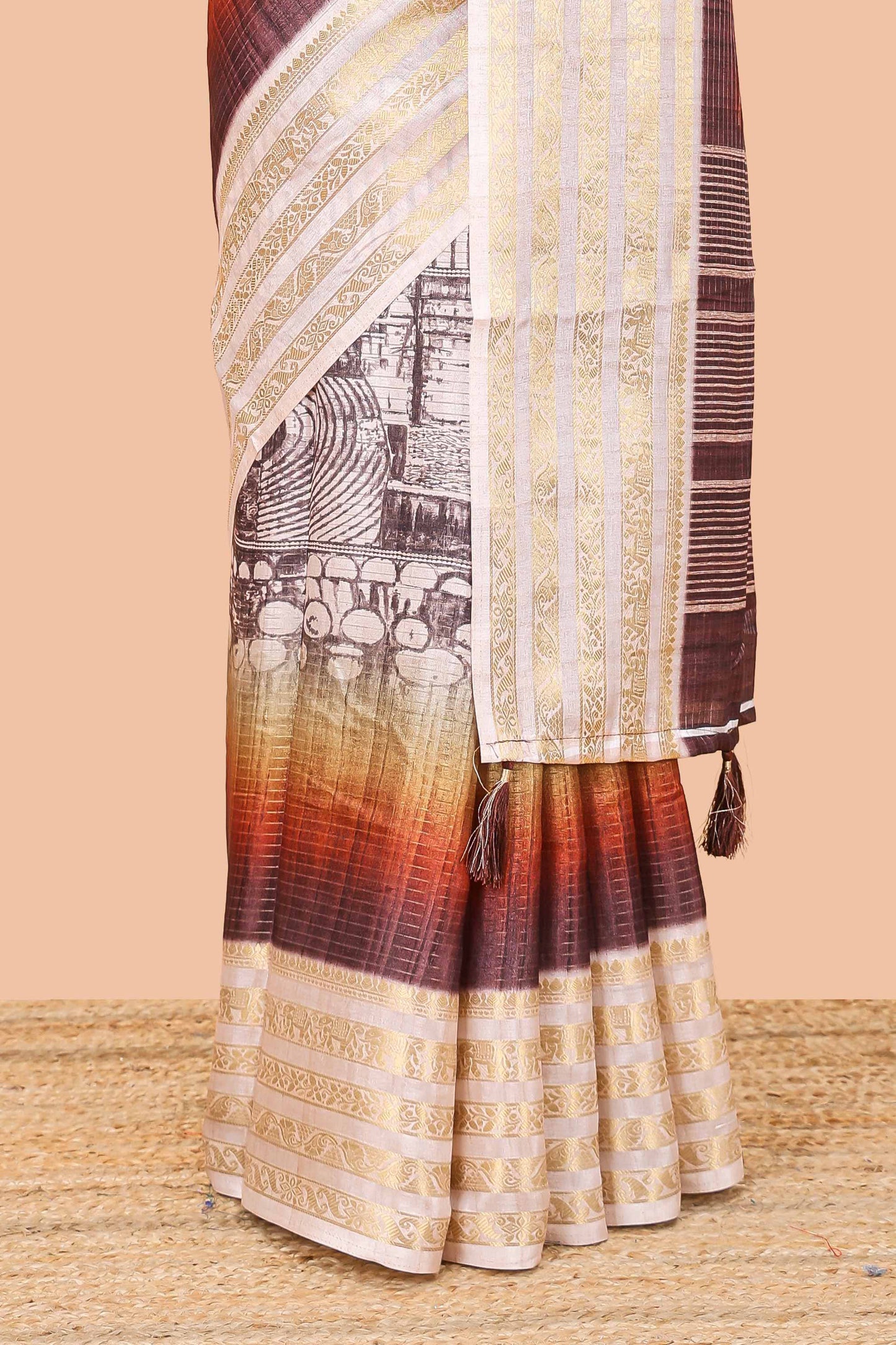 Brown dola silk saree with temple architecture print, zari striped pallu and border
