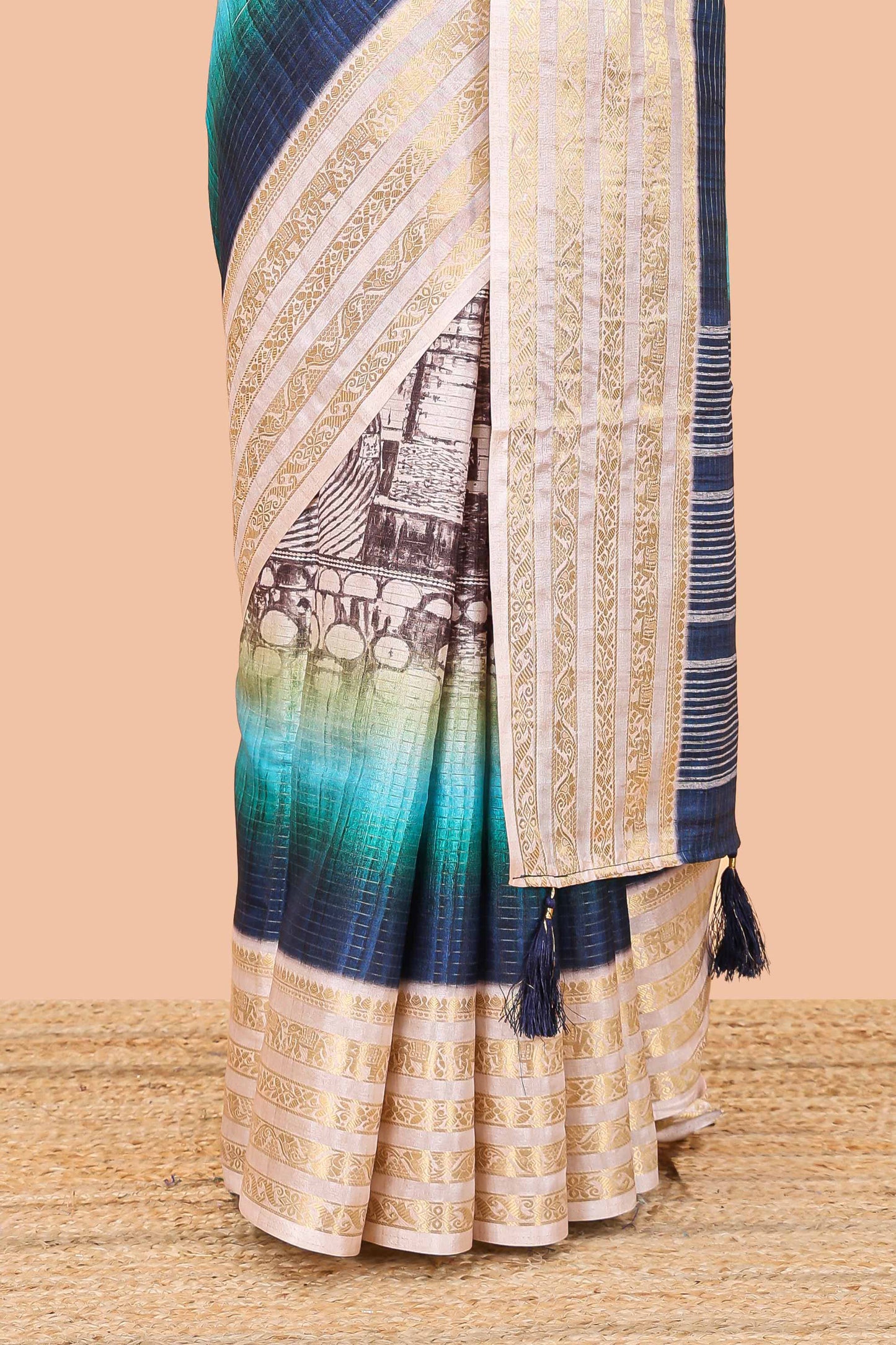 Blue dola silk saree with temple architecture print, zari striped pallu and border