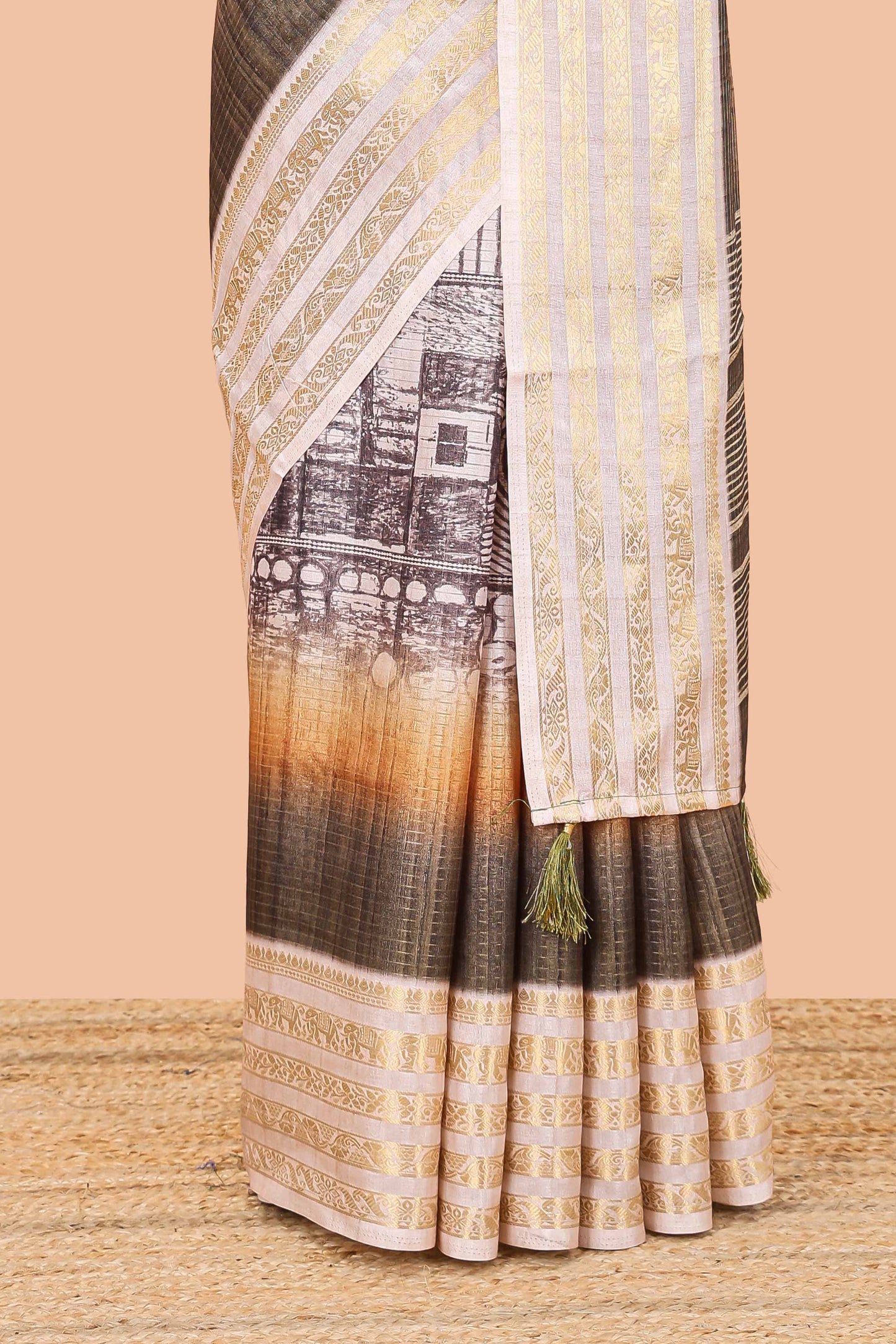 Green dola silk saree with temple architecture print, zari striped pallu and border