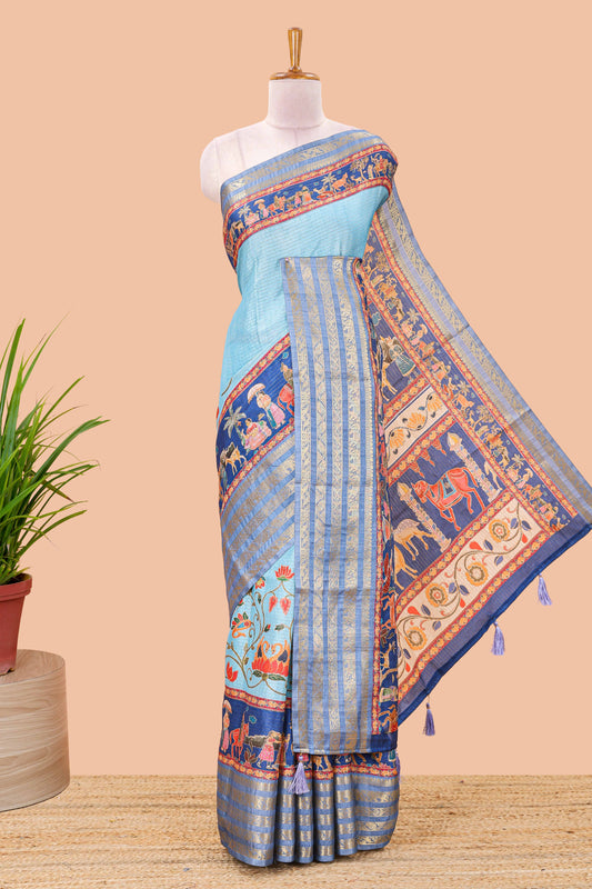 Blue dola silk saree with lotus bird creeper print and village themed pallu