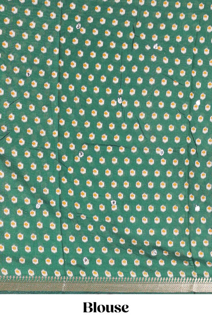 Cream chanderi cotton saree with geometric floral butta, green zari border and patola inspired mirror work