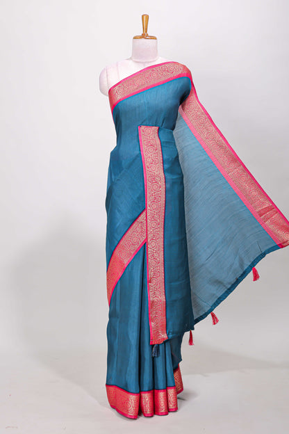 Blue marsh mellow plain saree with contrast gold zari border and butta blouse