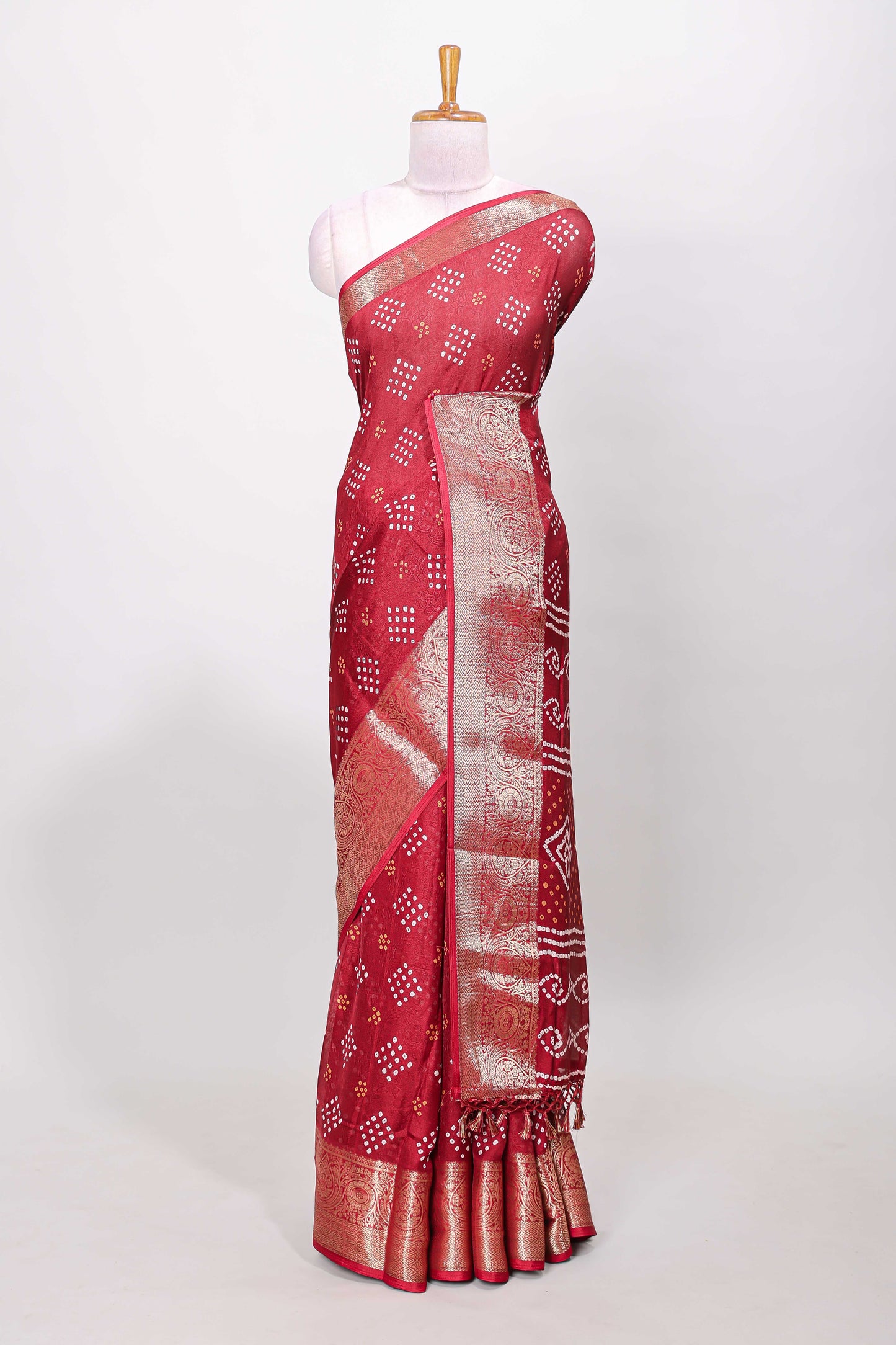 Red marsh mellow bandhani dot saree with gold zari border and butta blouse