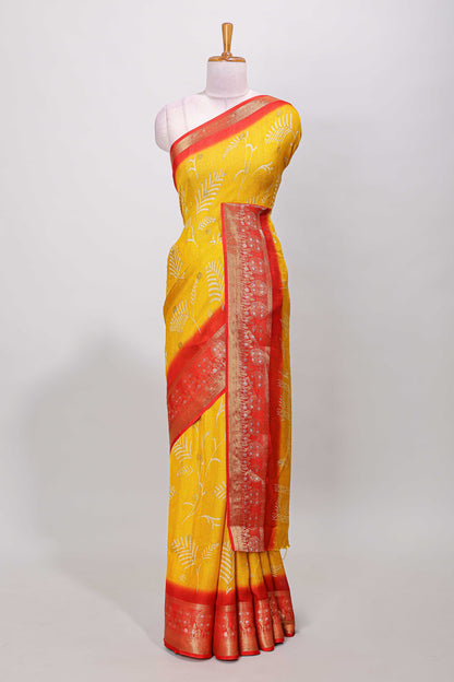 Yellow marsh mellow saree with leaf motifs, contrast border and floral butta blouse