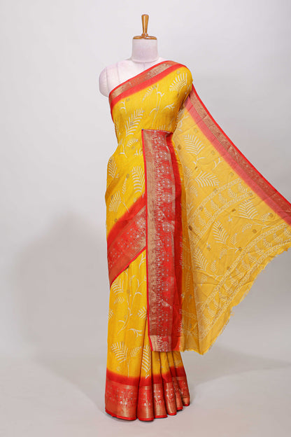 Yellow marsh mellow saree with leaf motifs, contrast border and floral butta blouse