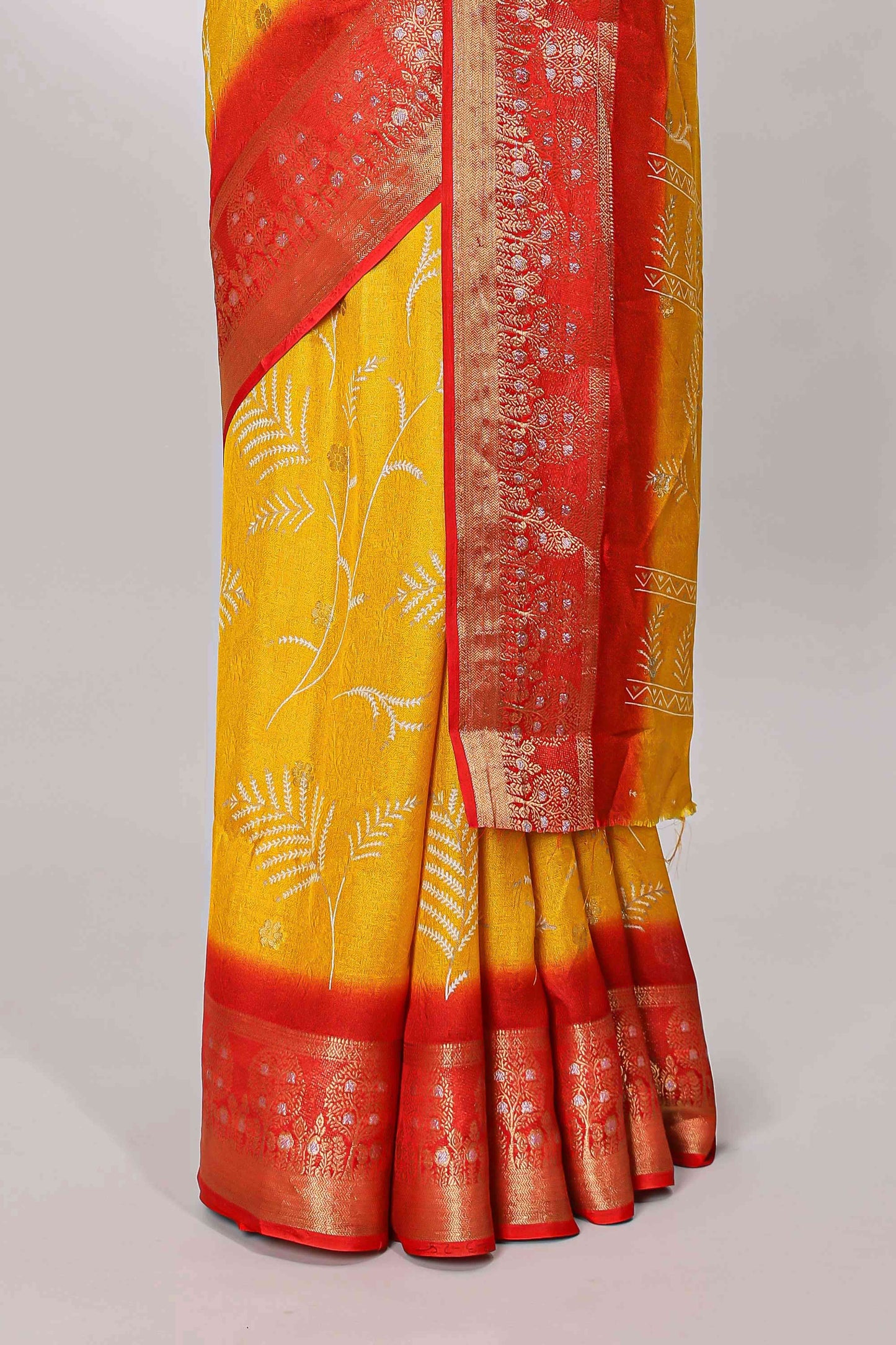 Yellow marsh mellow saree with leaf motifs, contrast border and floral butta blouse