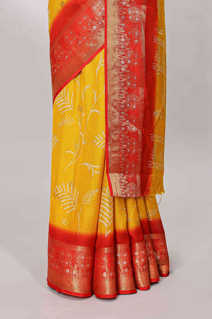Yellow marsh mellow saree with leaf motifs, contrast border and floral butta blouse