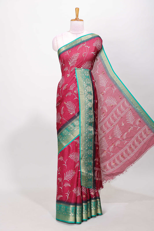 Maroon marsh mellow saree with leaf motifs, contrast border and floral butta blouse