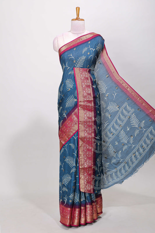 Blue marsh mellow saree with leaf motifs, contrast border and floral butta blouse