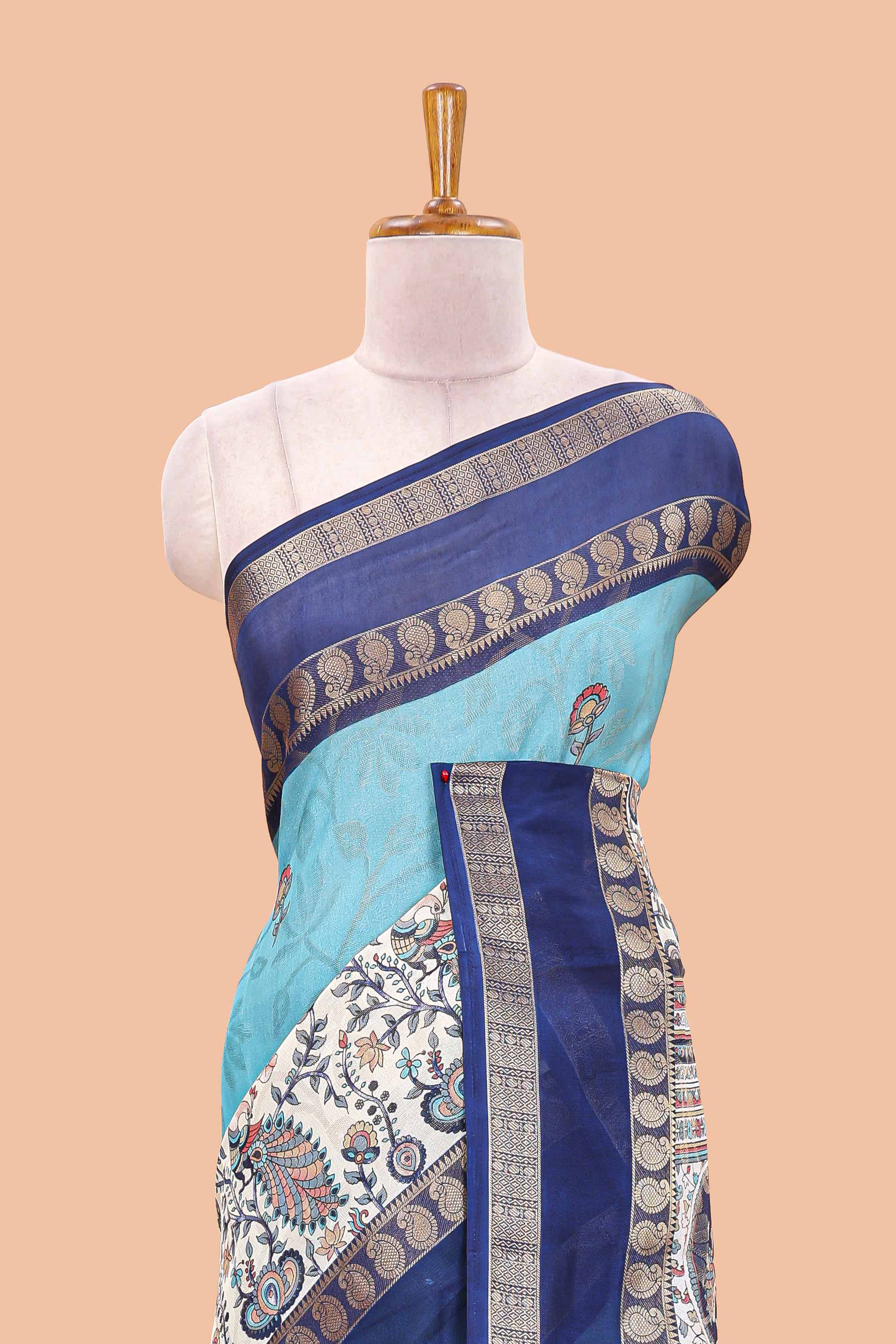 Blue dola silk floral motifs saree with kalamkari inspired pallu and peacock zari border