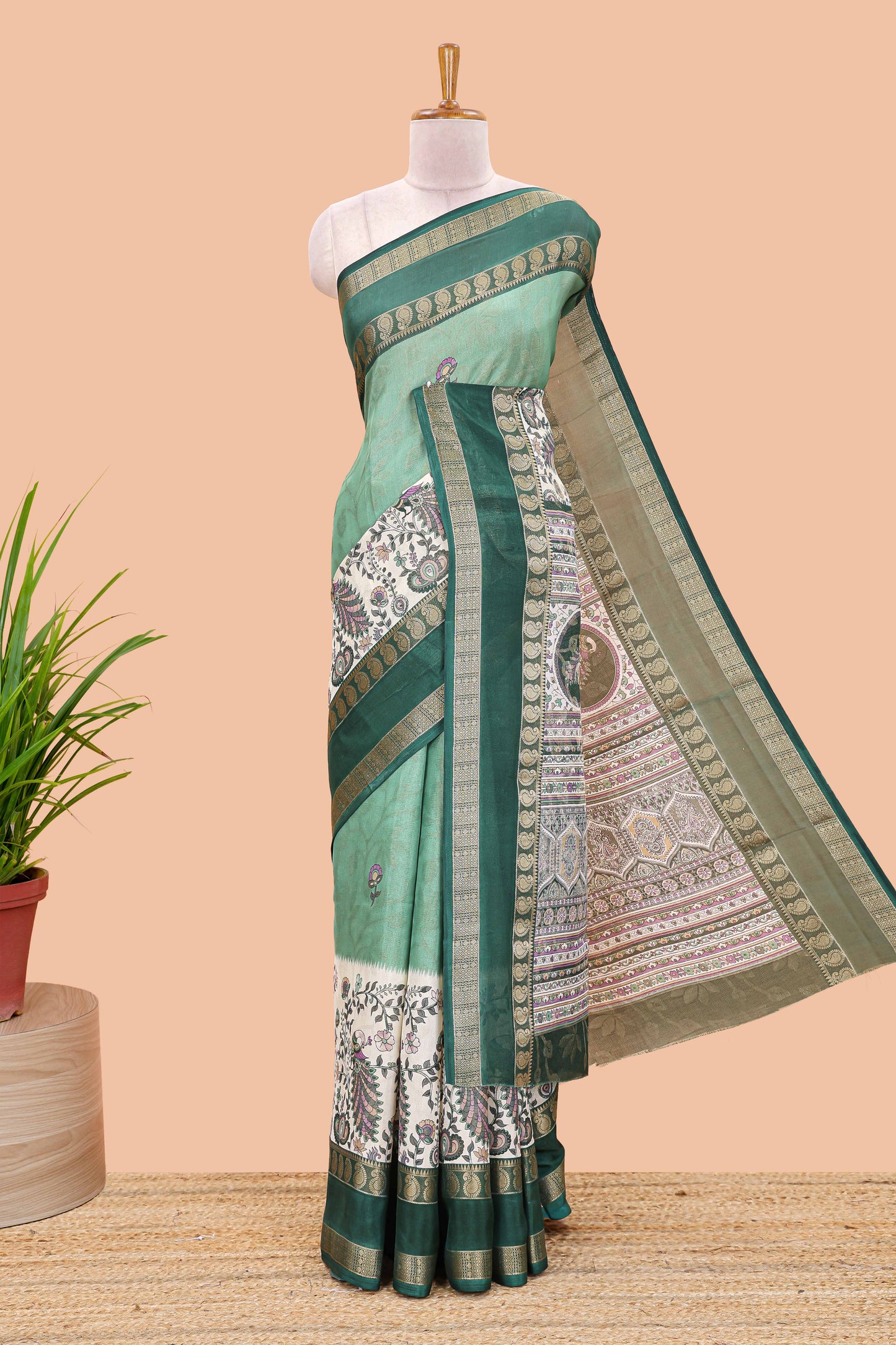 Green dola silk floral motifs saree with kalamkari inspired pallu and peacock zari border
