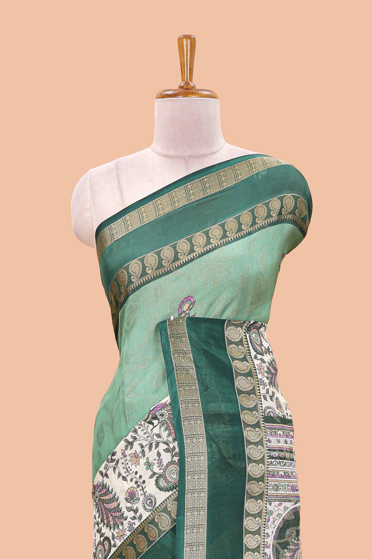 Green dola silk floral motifs saree with kalamkari inspired pallu and peacock zari border