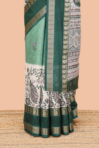 Green dola silk floral motifs saree with kalamkari inspired pallu and peacock zari border