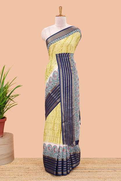 Yellow marsh georgette saree with shibori print with gold zari stripes and contrast kalamkari style  peacock pallu