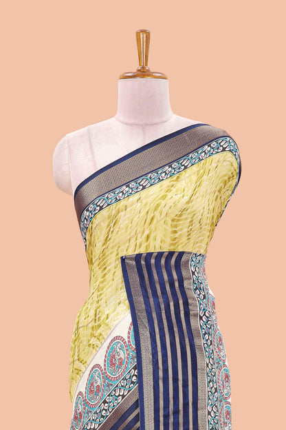 Yellow marsh georgette saree with shibori print with gold zari stripes and contrast kalamkari style  peacock pallu