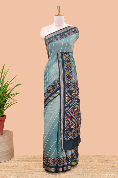 Green chanderi cotton saree featuring diagonal stripes and ikkat print pallu