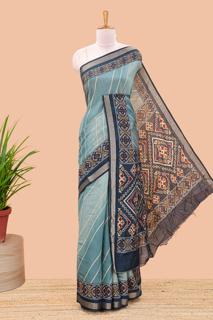 Green chanderi cotton saree featuring diagonal stripes and ikkat print pallu