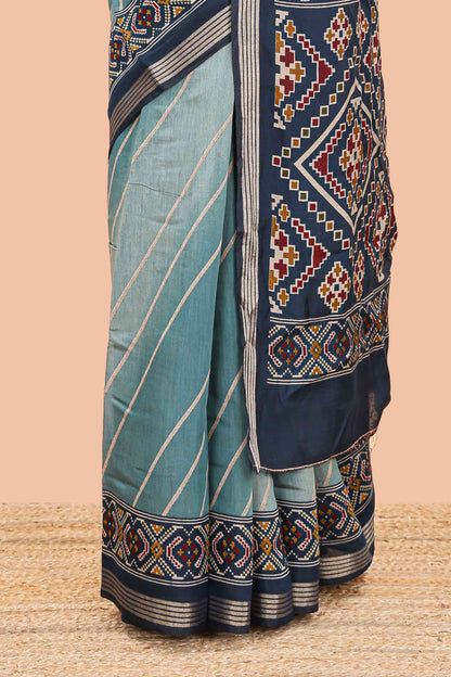 Green chanderi cotton saree featuring diagonal stripes and ikkat print pallu