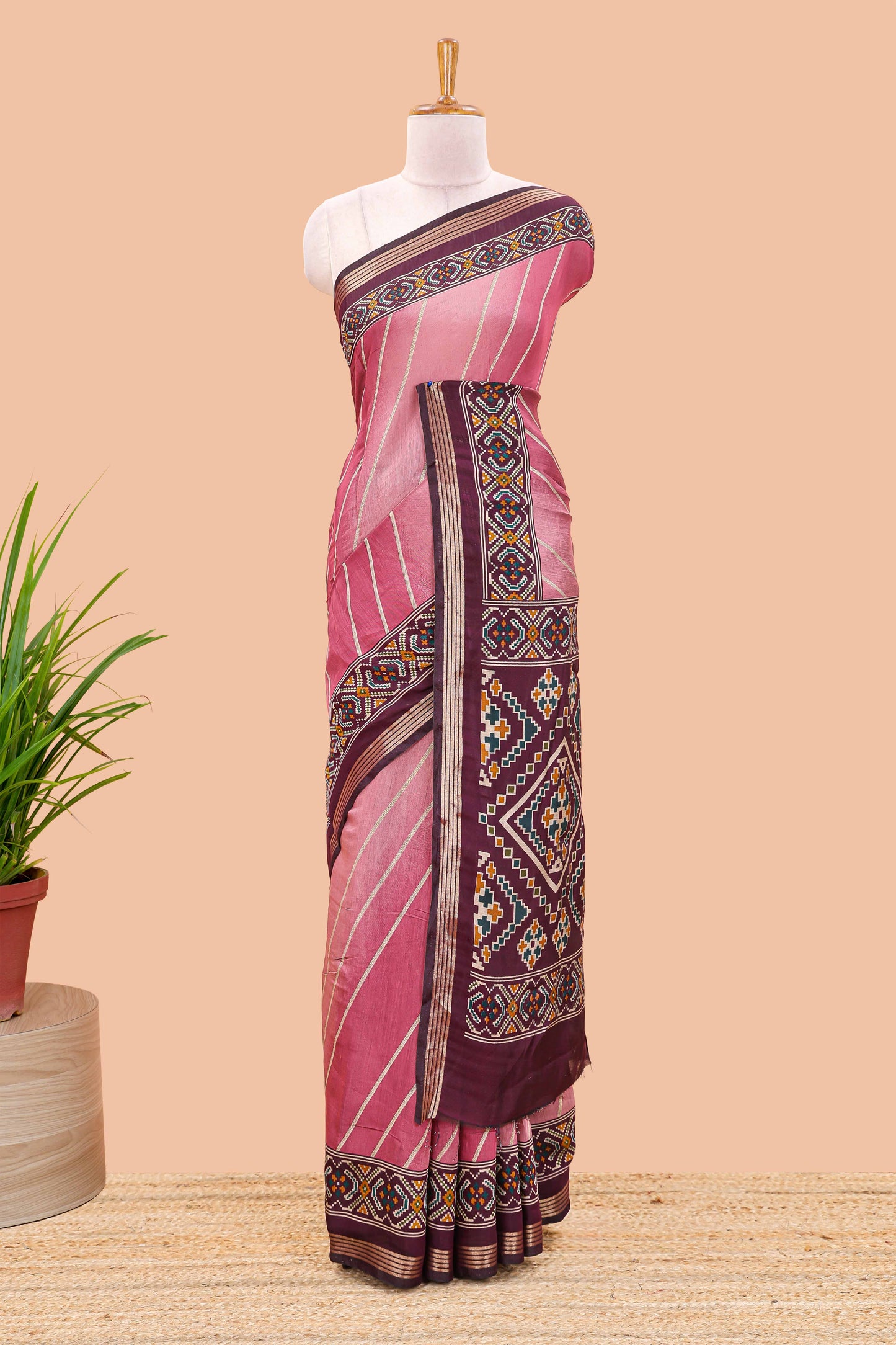 Pink chanderi cotton saree featuring diagonal stripes and ikkat print pallu