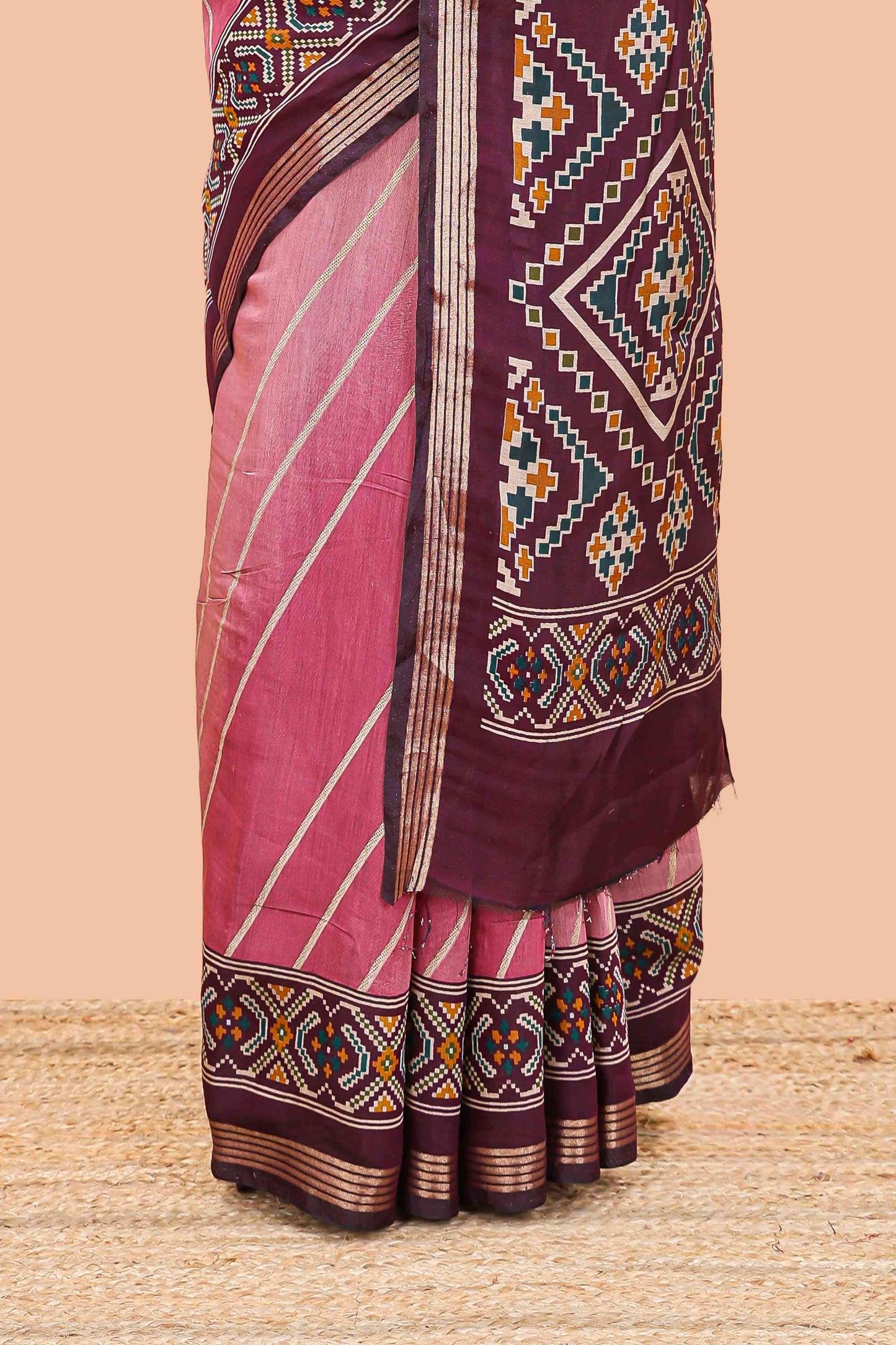 Pink chanderi cotton saree featuring diagonal stripes and ikkat print pallu