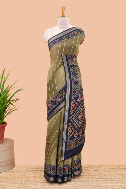 Green chanderi cotton saree featuring diagonal stripes and ikkat print pallu
