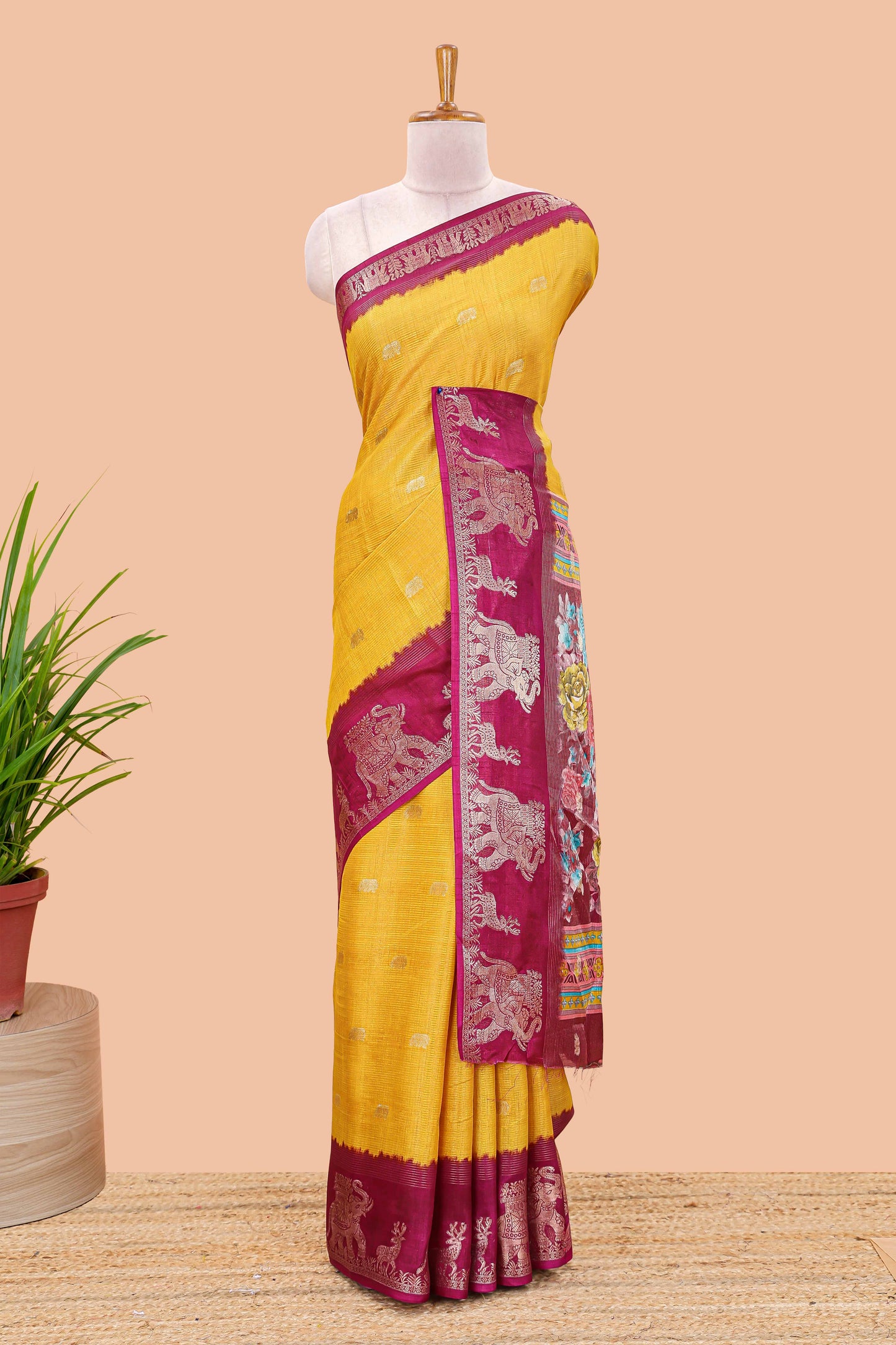 Yellow dola silk saree with elephant butta design and kalamkari print blouse