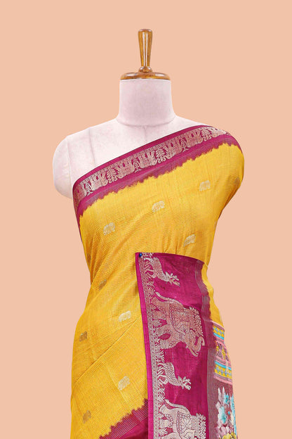 Yellow dola silk saree with elephant butta design and kalamkari print blouse