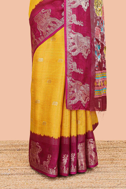 Yellow dola silk saree with elephant butta design and kalamkari print blouse