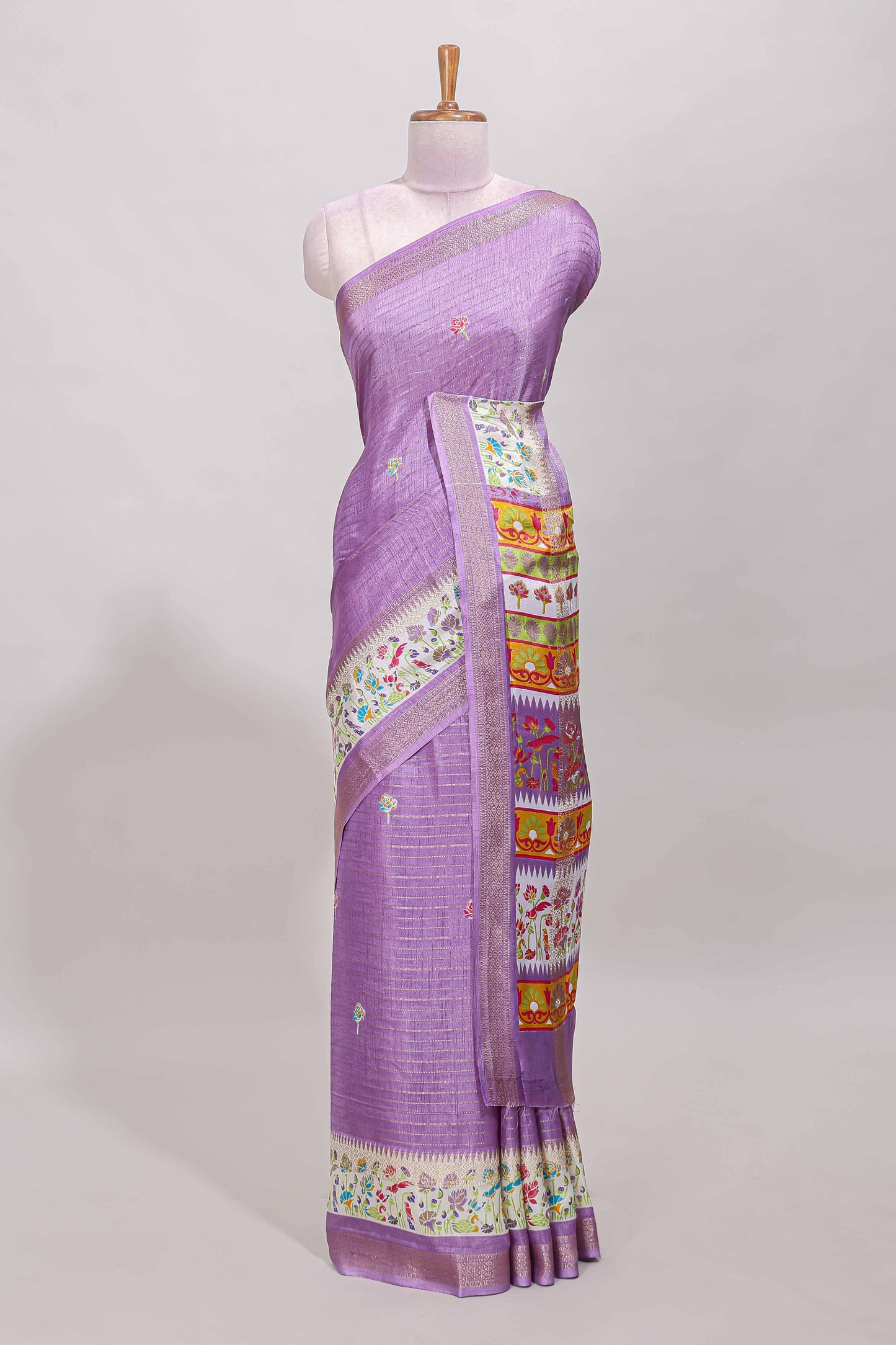 Purple dola silk saree with striped floral motifs and bird & floral bottom design with self zari border and matching blouse