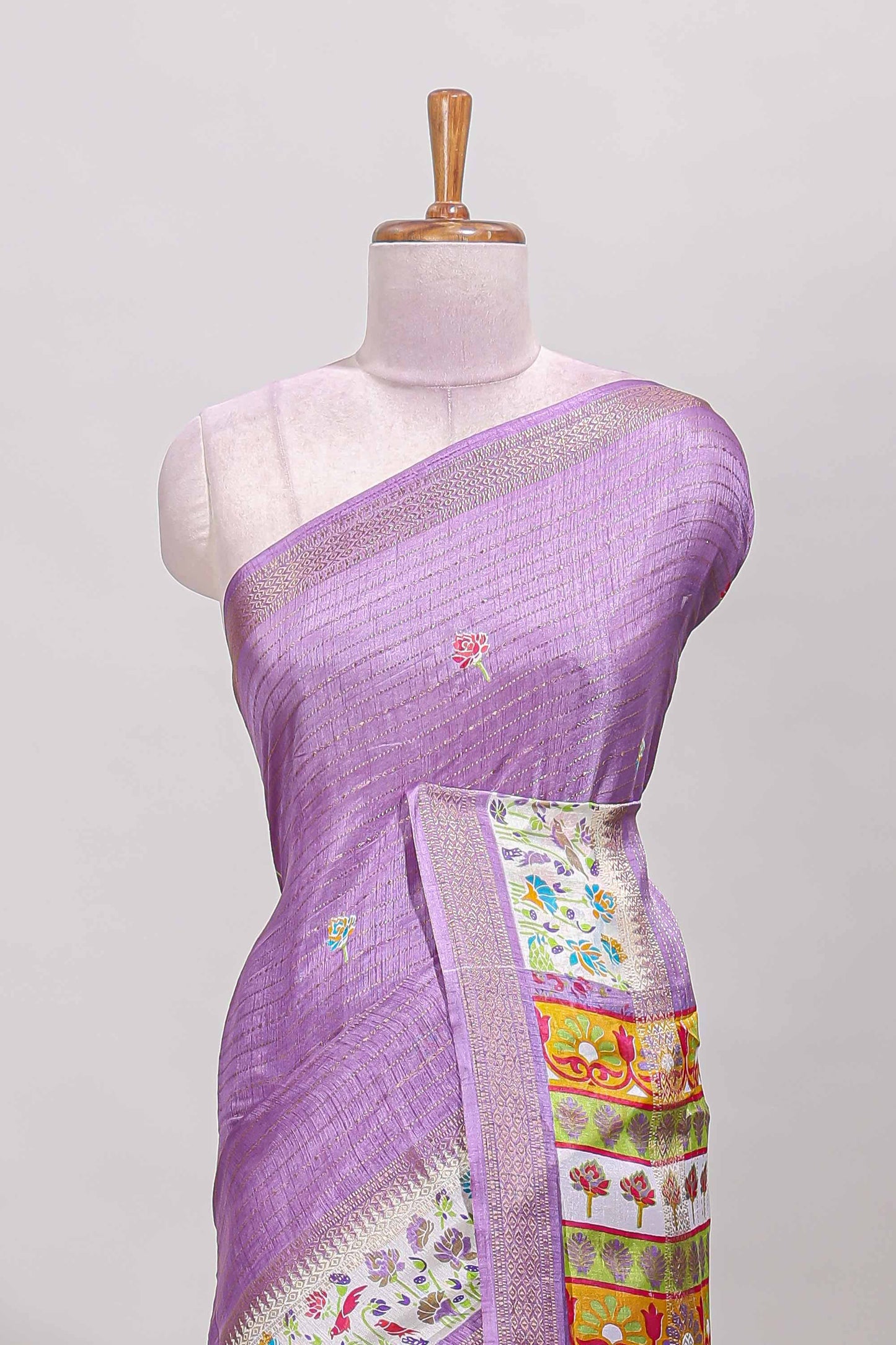 Purple dola silk saree with striped floral motifs and bird & floral bottom design with self zari border and matching blouse