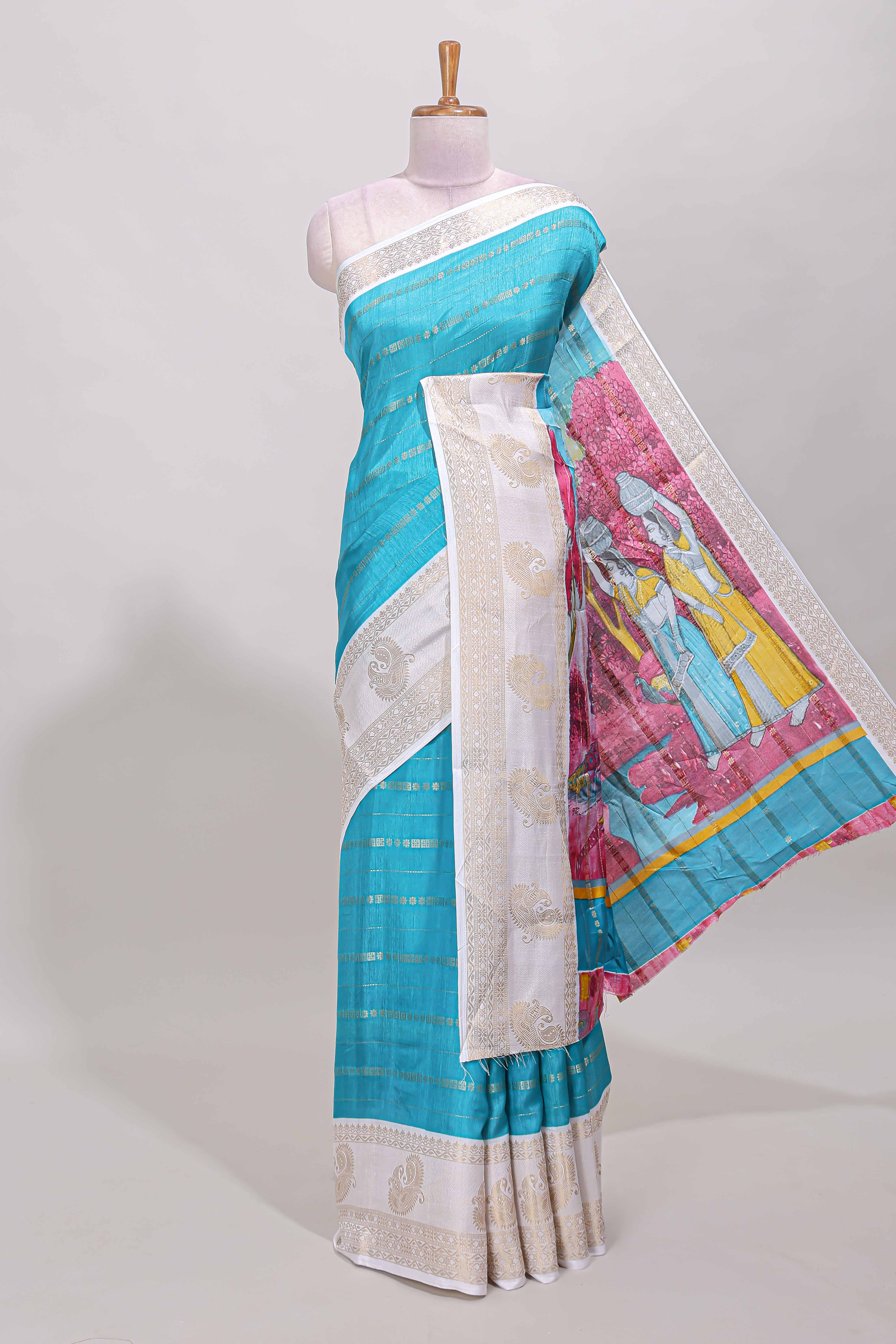 Blue zari striped dola silk saree with contrast zari border and printed pallu