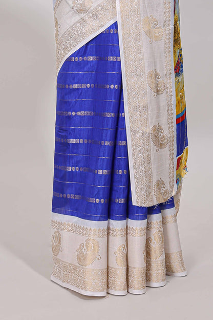 Royal blue zari striped dola silk saree with contrast zari border and printed pallu