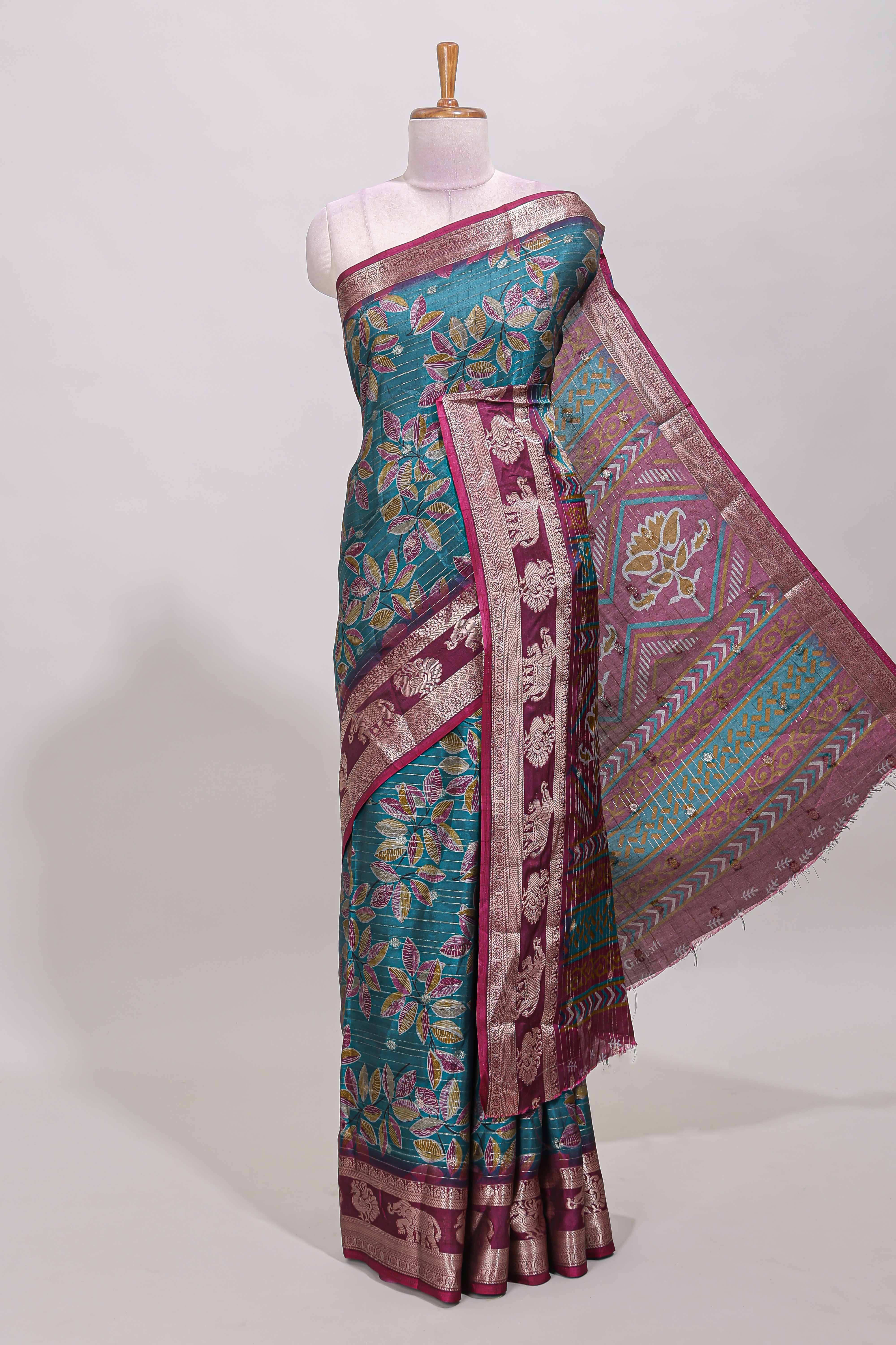 Green zari striped floral design dola silk saree with contrast zari border and printed blouse