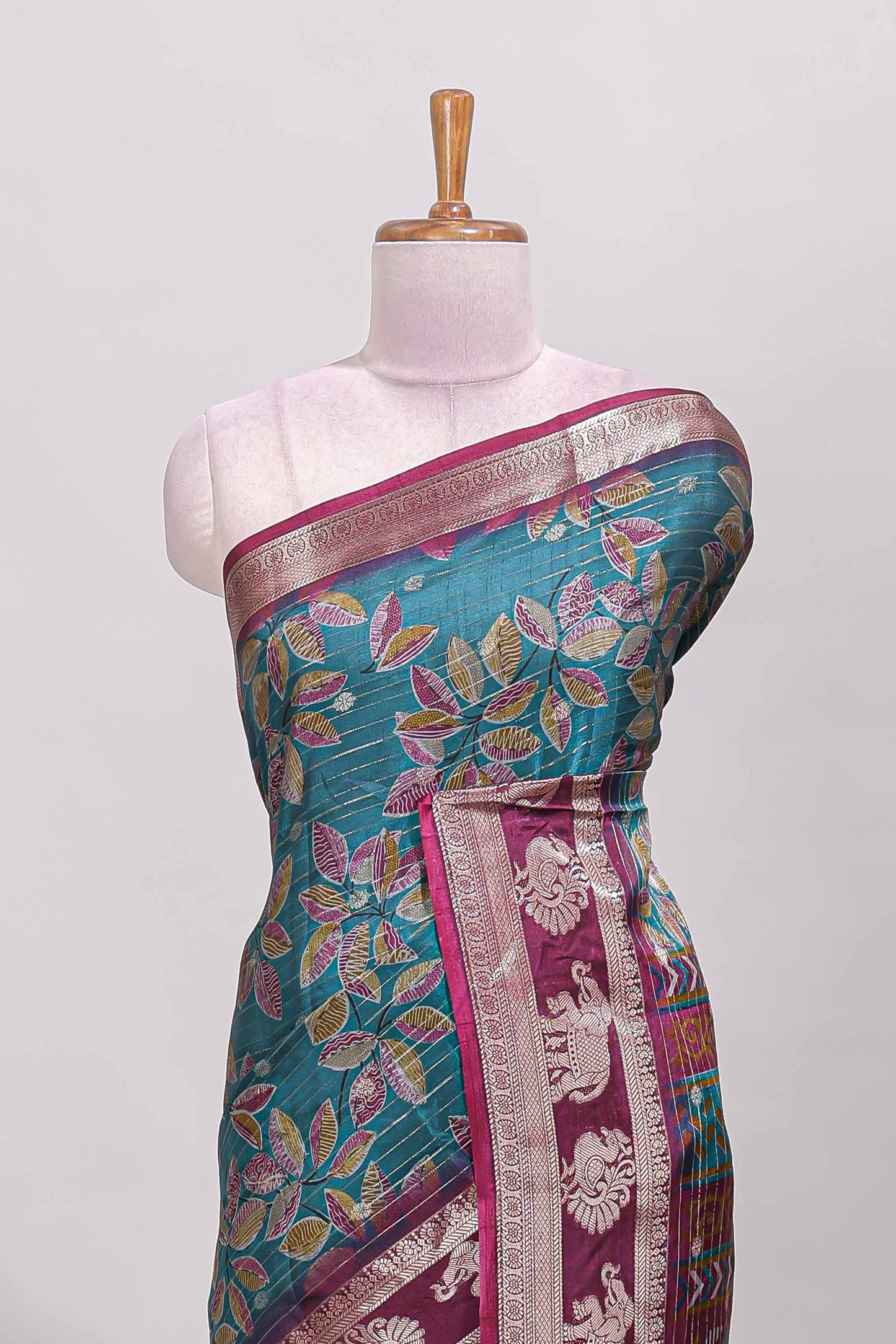 Green zari striped floral design dola silk saree with contrast zari border and printed blouse