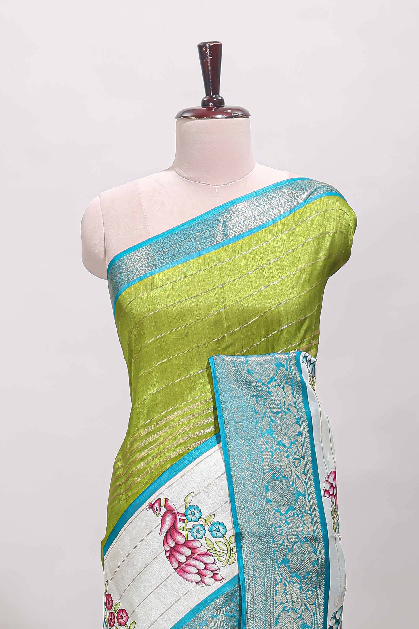 Green stripes dola silk saree with bottom peacock design, contrast zari border and printed pallu