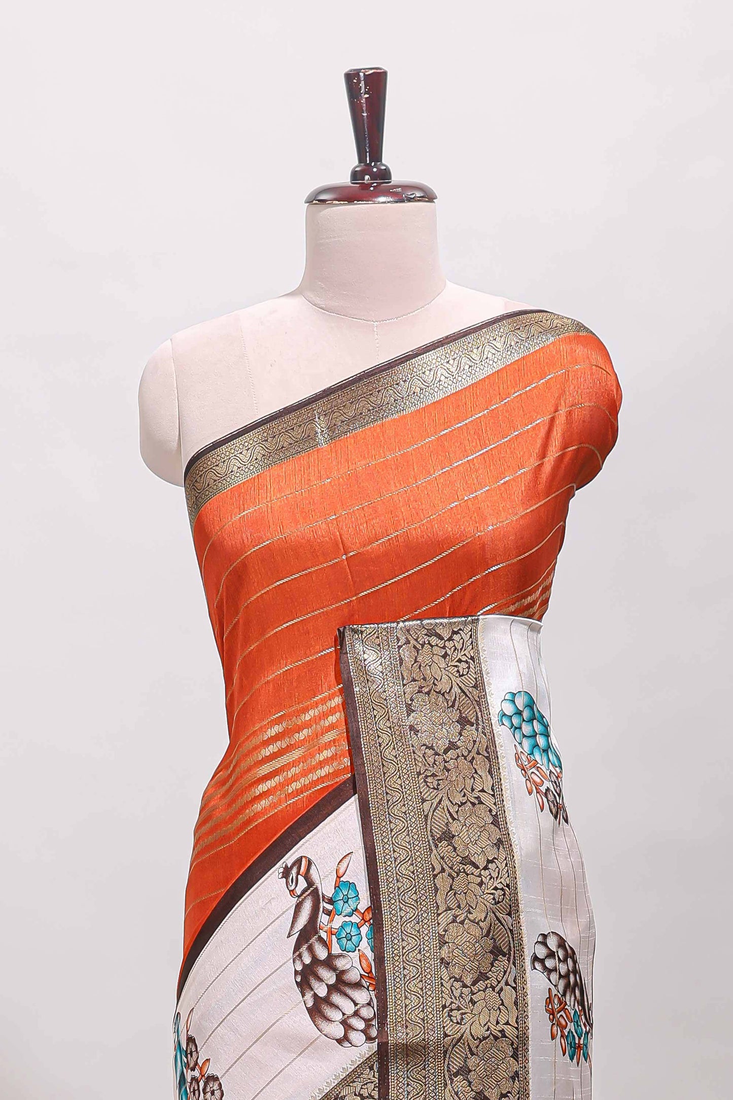 Orange stripes dola silk saree with bottom peacock design, contrast zari border and printed pallu