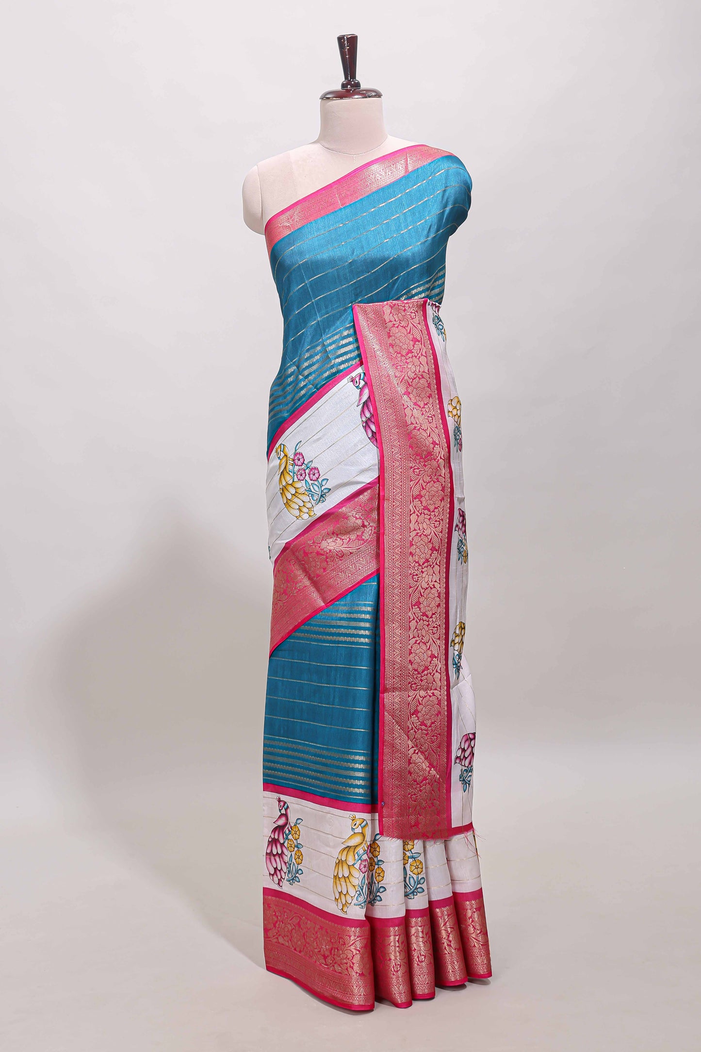 Blue stripes dola silk saree with bottom peacock design, contrast zari border and printed pallu
