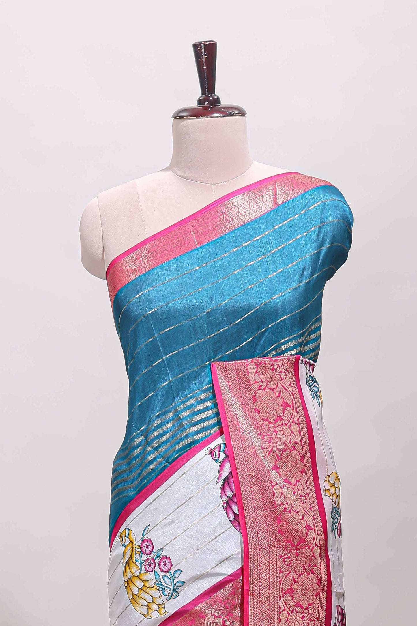 Blue stripes dola silk saree with bottom peacock design, contrast zari border and printed pallu