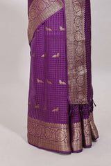 Purple checked peacock zari motifs dola silk saree with self zari border and matching blouse