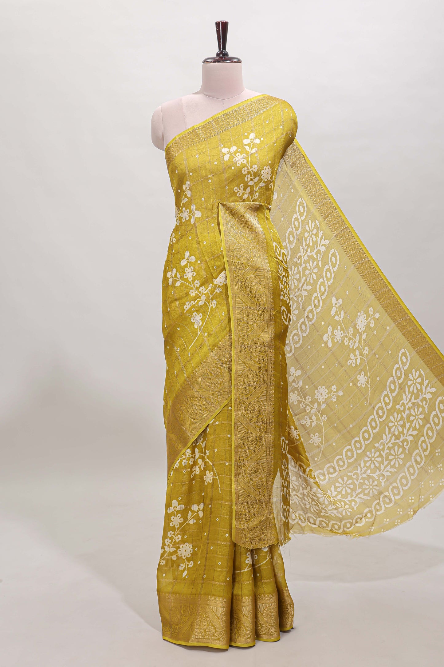 Mustard checked floral design dola saree with self zari border and matching blouse