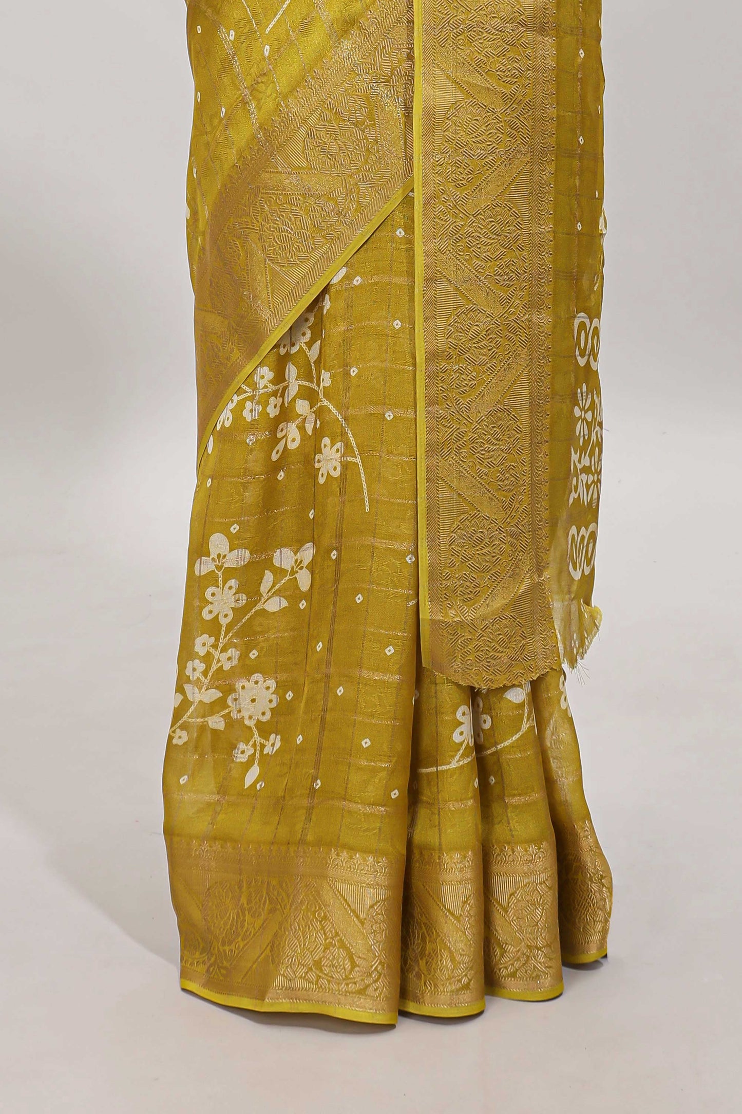 Mustard checked floral design dola saree with self zari border and matching blouse