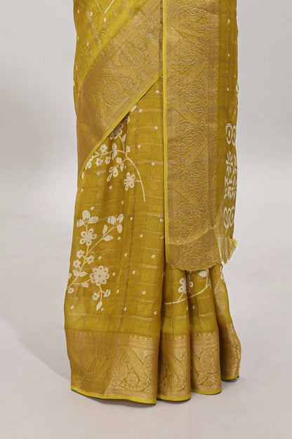 Mustard checked floral design dola saree with self zari border and matching blouse