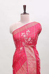 Pink checked floral design dola saree with self zari border and matching blouse