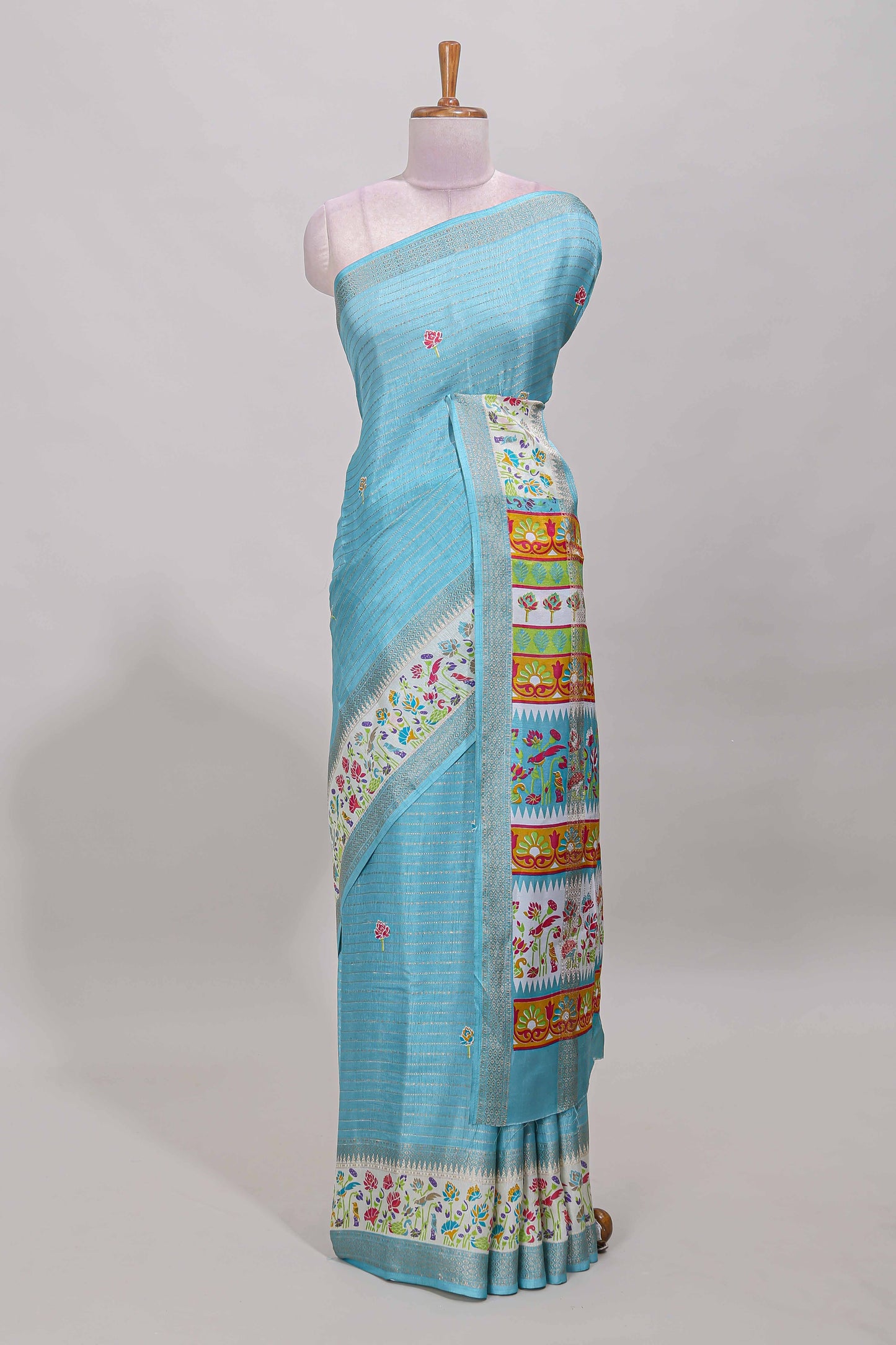 Blue dola silk saree with striped floral motifs and bird & floral bottom design with self zari border and matching blouse