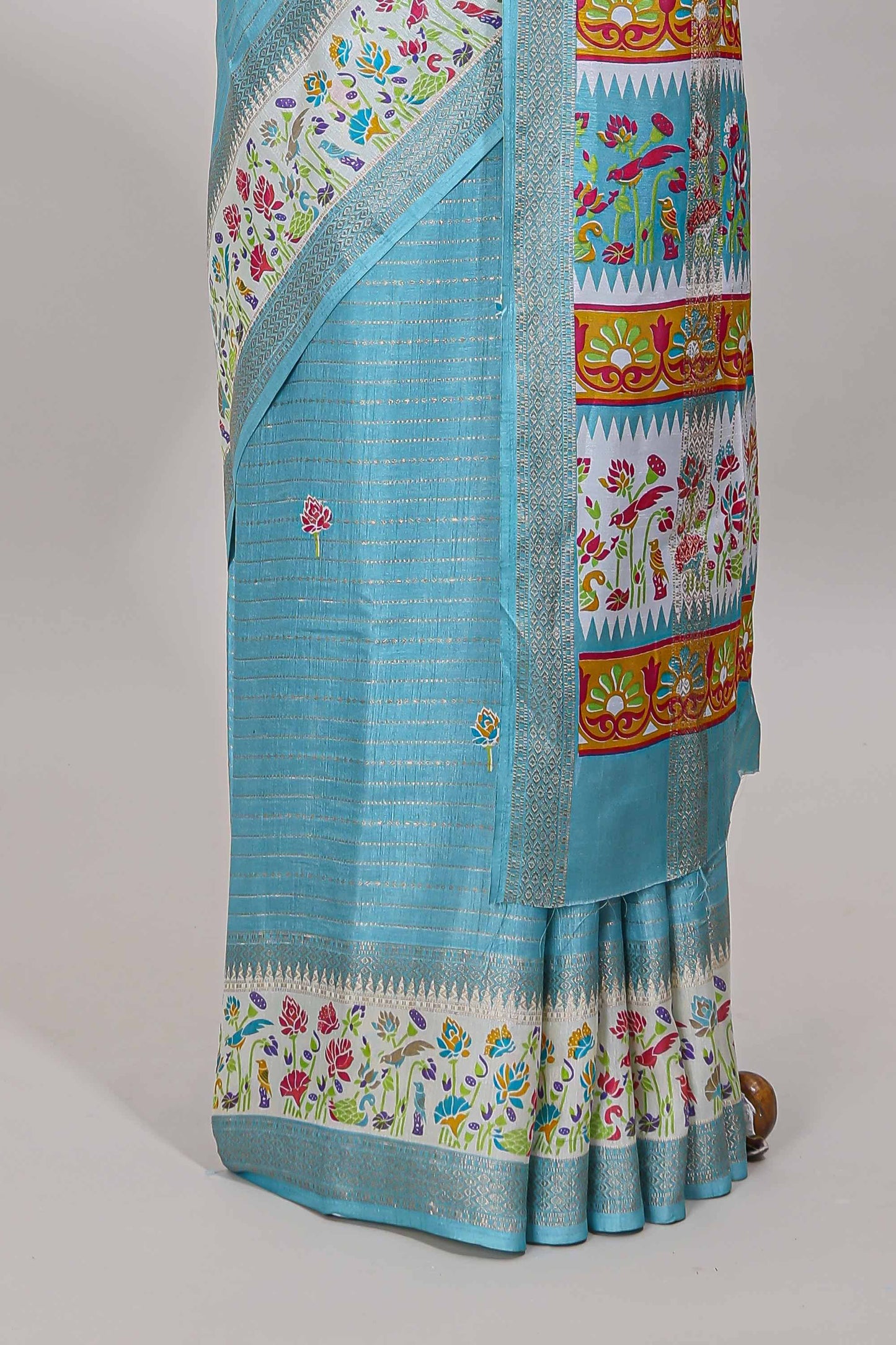 Blue dola silk saree with striped floral motifs and bird & floral bottom design with self zari border and matching blouse