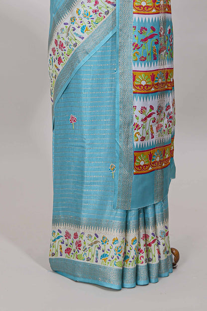 Blue dola silk saree with striped floral motifs and bird & floral bottom design with self zari border and matching blouse