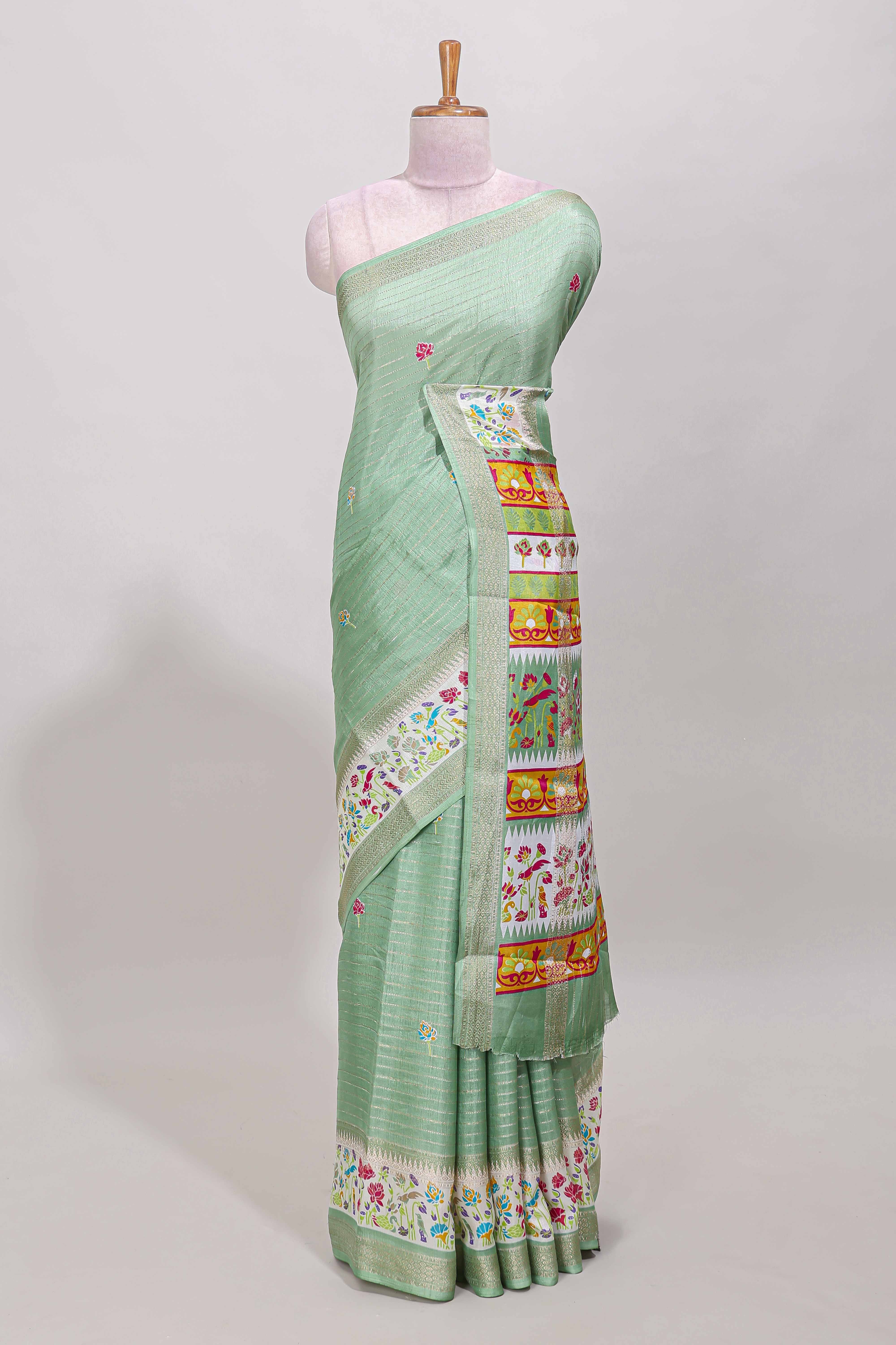 Green dola silk saree with striped floral motifs and bird & floral bottom design with self zari border and matching blouse