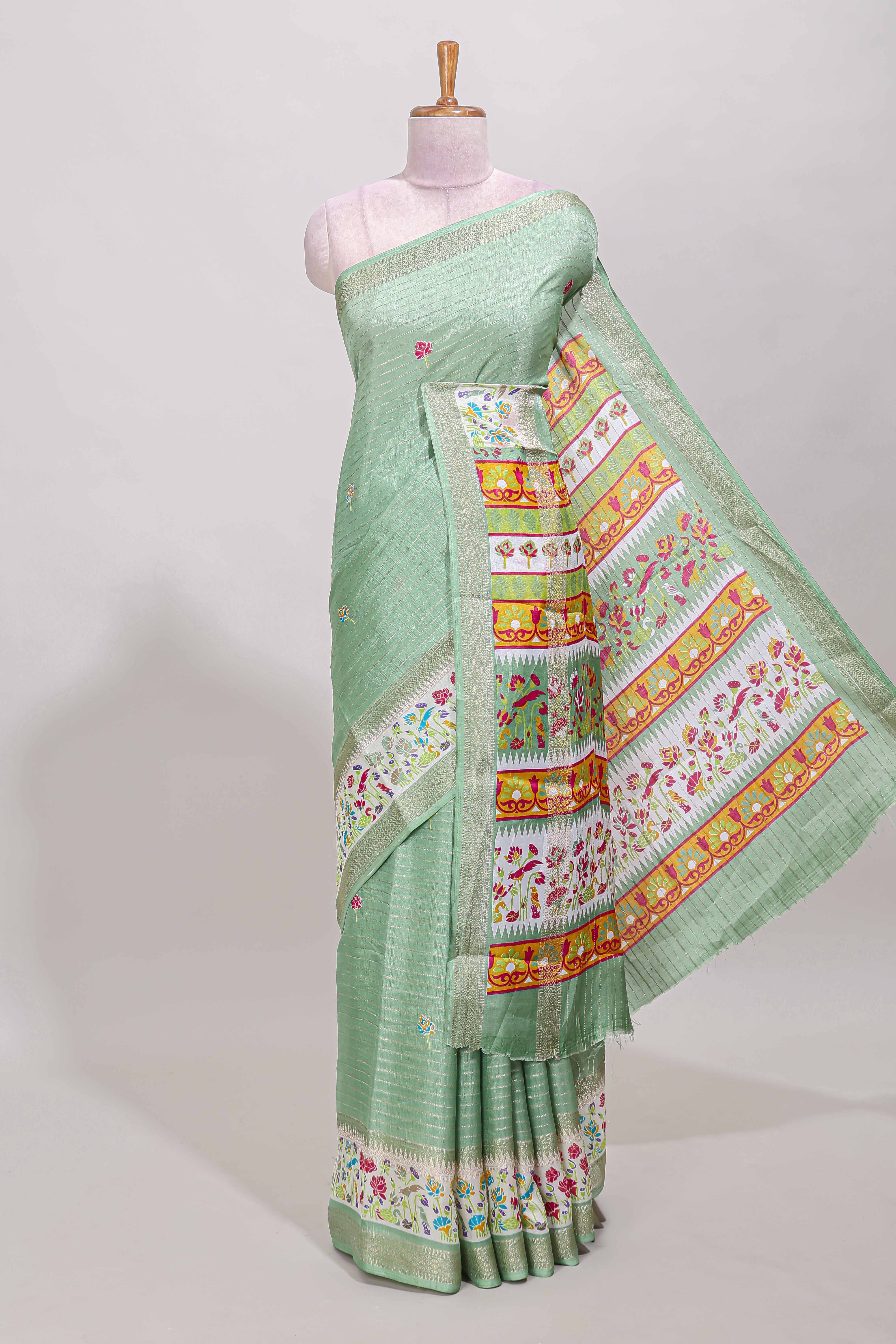 Green dola silk saree with striped floral motifs and bird & floral bottom design with self zari border and matching blouse