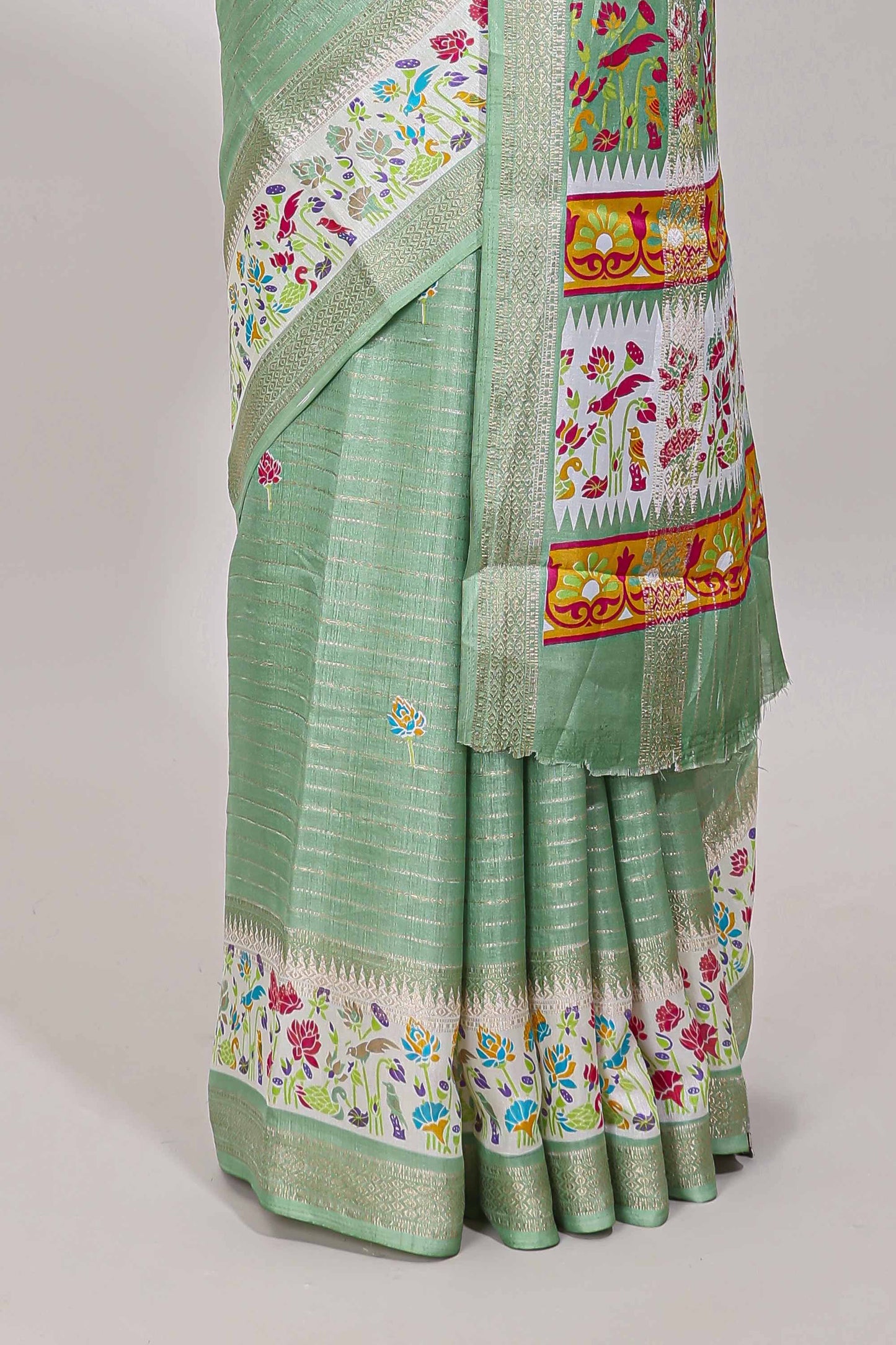 Green dola silk saree with striped floral motifs and bird & floral bottom design with self zari border and matching blouse