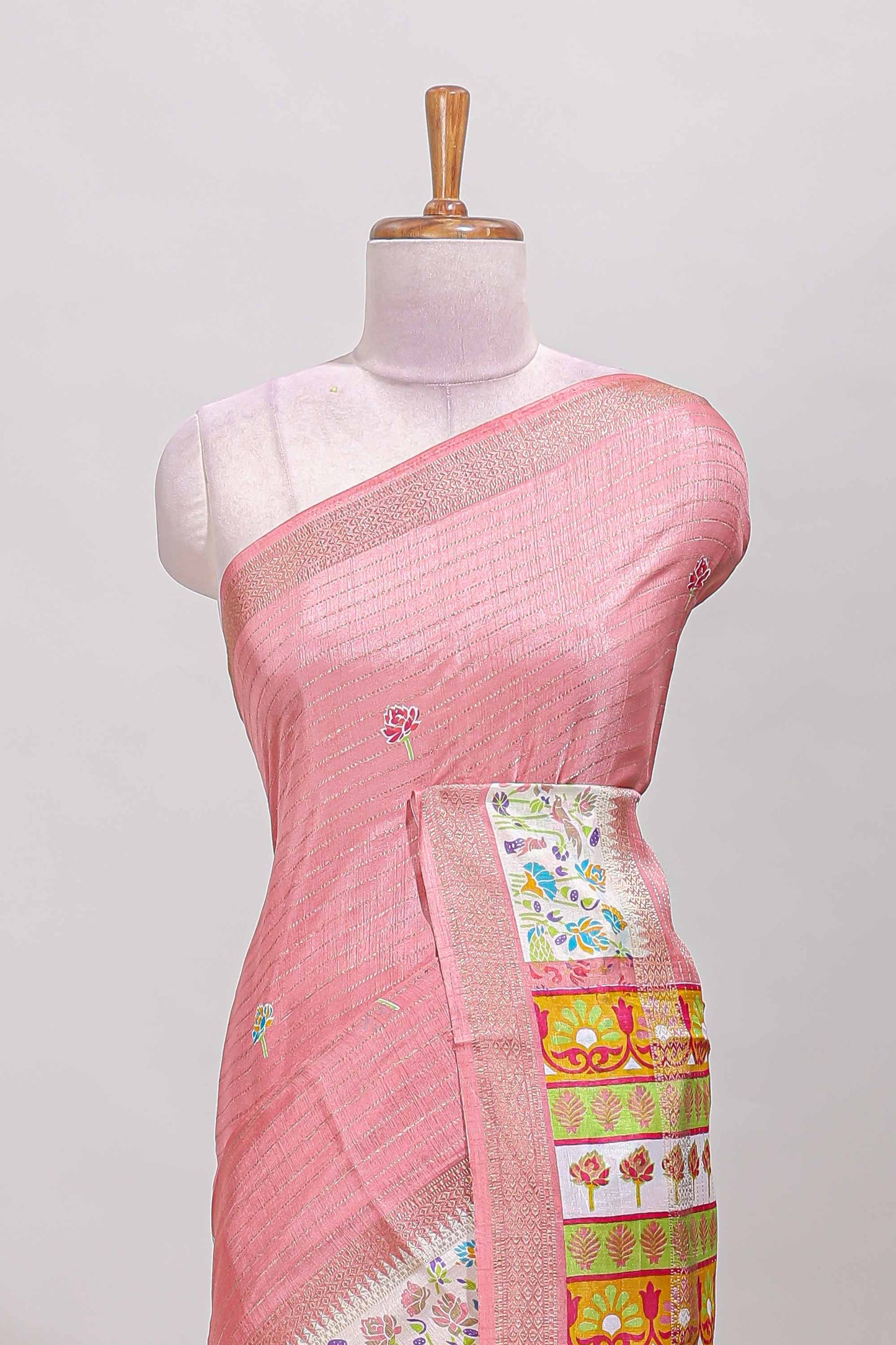 Baby pink dola silk saree with striped floral motifs and bird & floral bottom design with self zari border and matching blouse